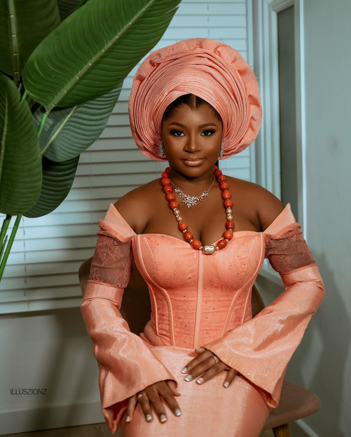 Client in a peach gele and matching gown